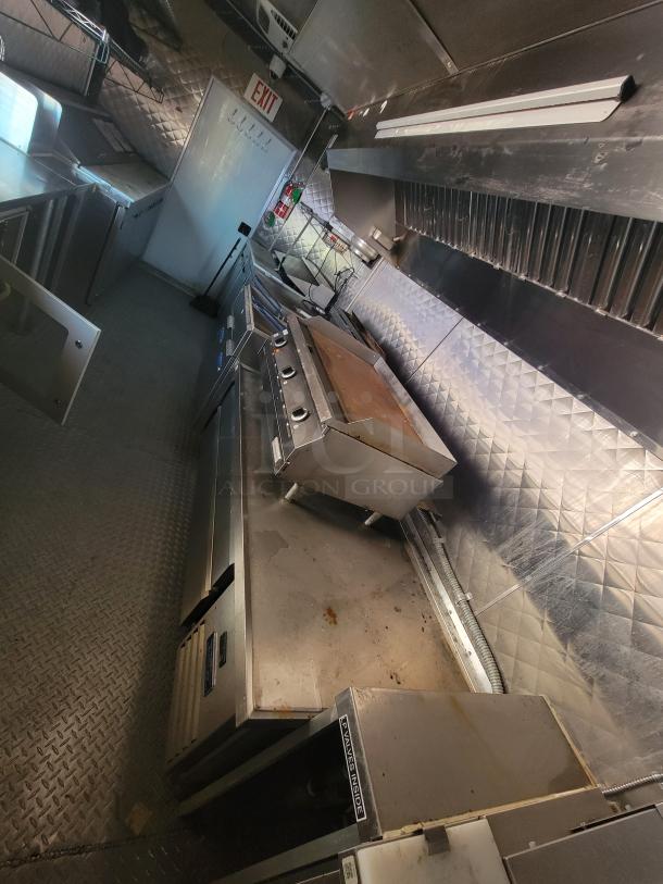 2021 Quality 24' food trailer, stainless steel interior, commercial exhaust hood, two gas fryers, griddle, Arctic Air units.