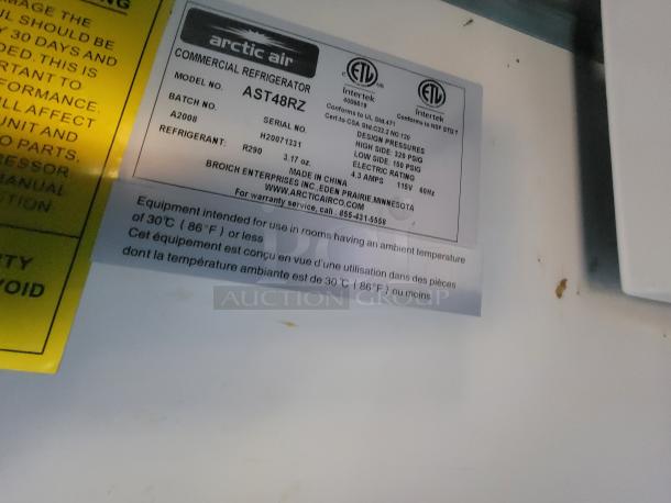 Arctic Air commercial refrigerator label showing model AST48RZ, refrigerant R290, serial H20071331, and equipment specs.