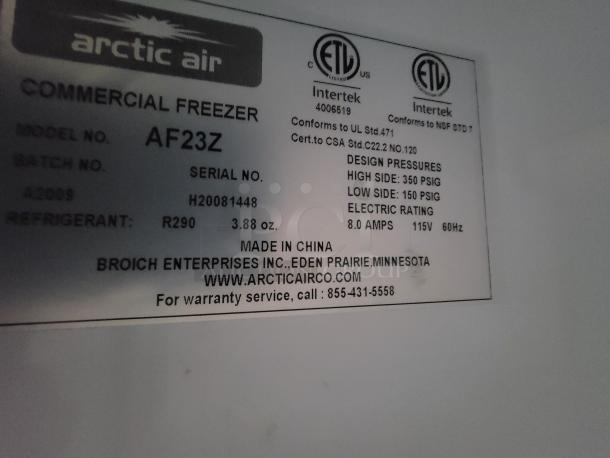 Label on Arctic Air AF23Z commercial freezer detailing model, batch, serial number, refrigerant type, and contact information.
