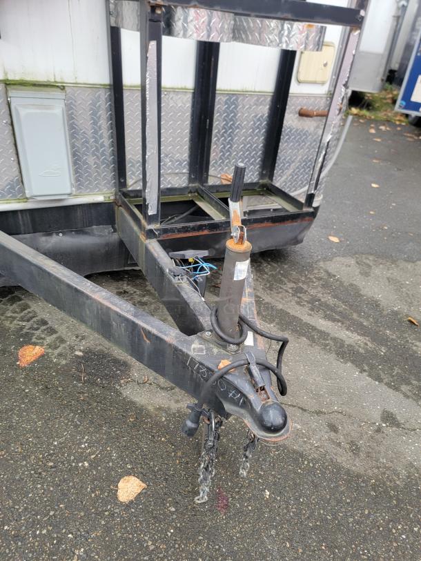 2020 Rock Solid 16' mobile trailer hitch and frame close-up, showing diamond plate detail and sturdy construction.