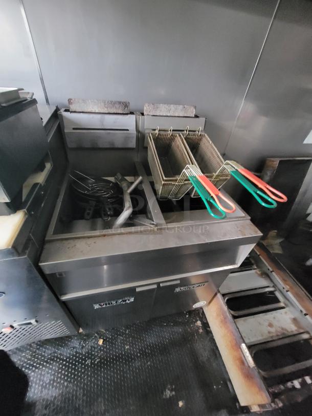 2020 Rock Solid mobile trailer kitchen featuring a Vulcan-style electric countertop fryer with dual baskets and protective hood.