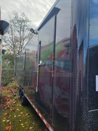 2021 SDG 24' refrigerated trailer, black, dual axle, 14,000 LB GVWR, for mobile kitchen/storage, excellent condition.