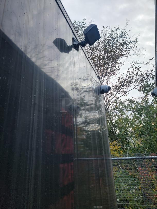 2021 SDG 24' refrigerated trailer exterior with mounted security cameras, emphasizing robust design.