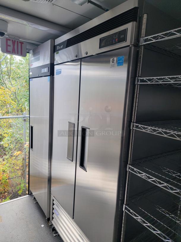 2021 SDG 24' refrigerated trailer interior with Turbo Air coolers, chrome wire shelving, and stainless steel worktops.