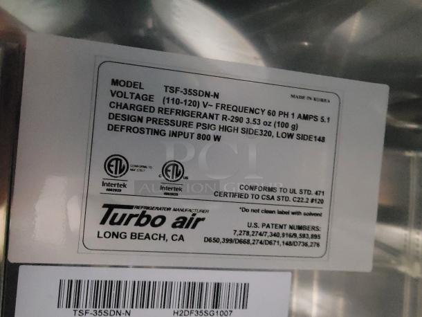 Turbo Air model TSF-35SDN-N label, indicating voltage, refrigerant R-290 charge, design pressure, and defrosting input.