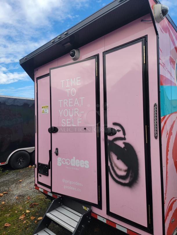 SDG Model 20 mobile retail/freezer trailer, pink exterior with "Goodees Provisions" branding. High-end refrigeration, security cameras, and sanitation setup. Ideal for frozen goods business.