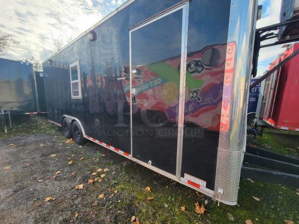 2021 24' Diamond Cargo mobile grocery/food trailer, black exterior, dual axles, side door, ready for commercial use.