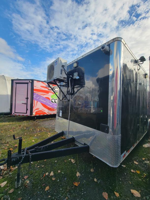 2021 24' Diamond Cargo trailer, black exterior, climate control unit, dome surveillance camera, and diamond plate accents.