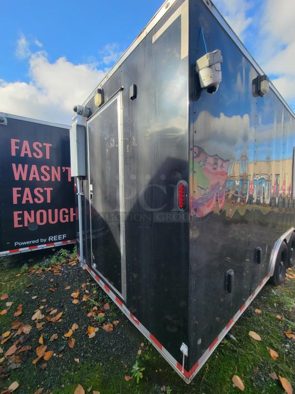 24' Diamond Cargo Mobile Grocery/Food Trailer, 2021 model, black exterior, dome surveillance camera, side door access.