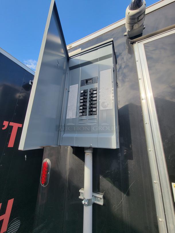 2021 Diamond Cargo trailer electrical panel and dome camera on exterior. Powered with main breaker panel, vital for mobile business.