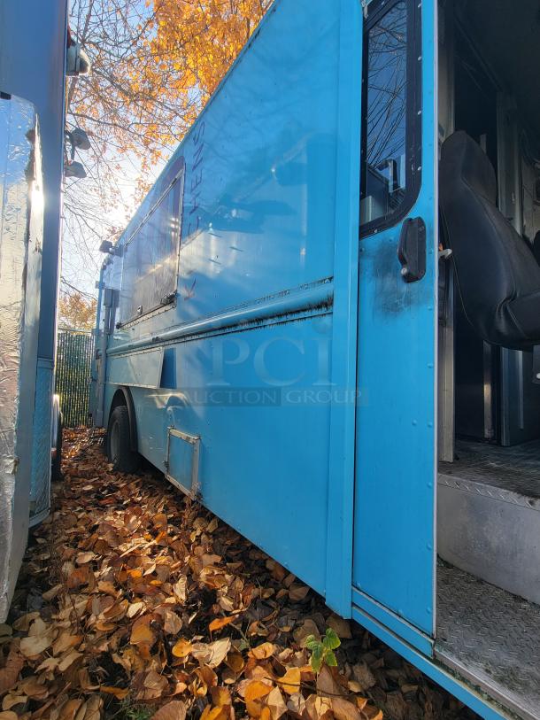 2007 Ford Utilimaster food truck, blue exterior, open door, project vehicle with high-end kitchen gear, needs restoration.