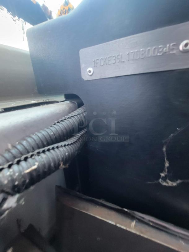 VIN plate showing "1FCKE39L17DB00345" on Ford Utilimaster Pro-Kitchen Food Truck interior.