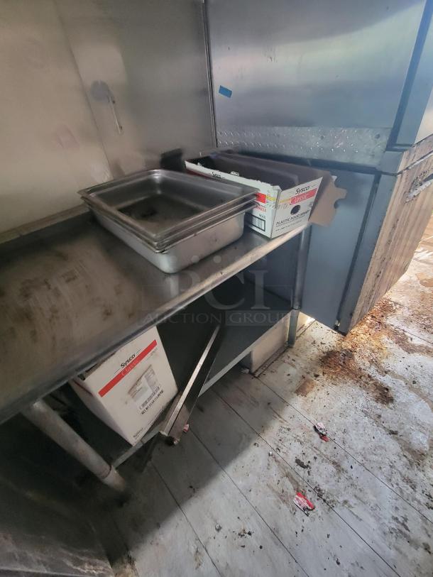 2007 Utilimaster Pro-Kitchen food truck interior, showing stainless steel prep area and storage. Needs restoration.