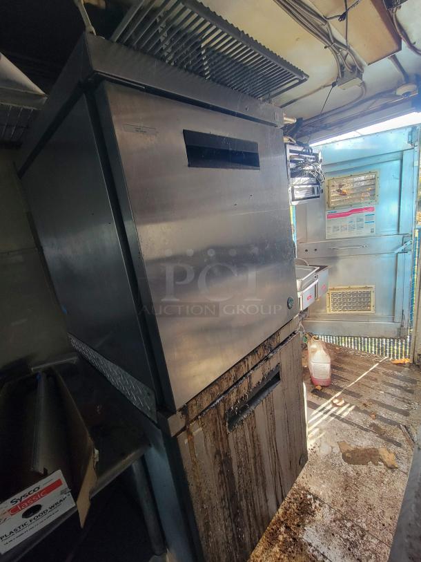 2007 Utilimaster food truck interior showing high-spec kitchen equipment, visible wear, and grime on metal surfaces. VIN: 1FCKE39L17DB00345.