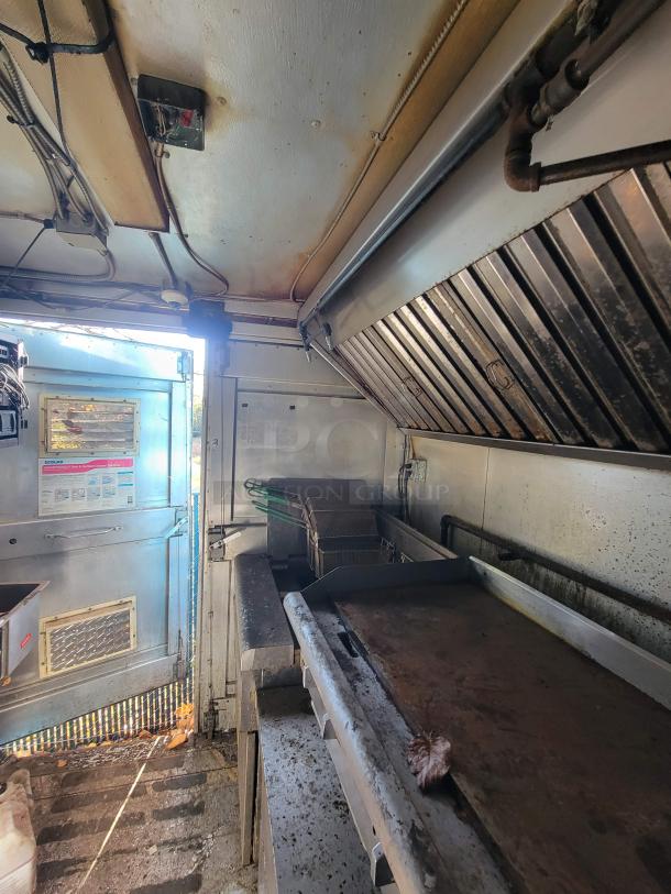 2007 Ford Utilimaster food truck interior, featuring high-end kitchen equipment. Visible wear, ideal for restoration.