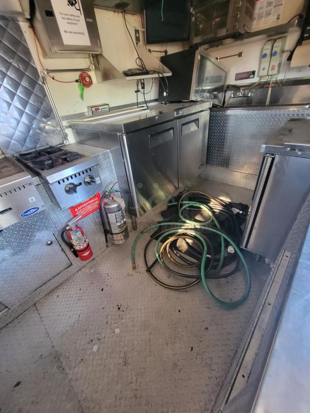 2018 STM 14-Foot Concession Trailer, stainless steel interior, commercial appliances, fire extinguisher, hoses.