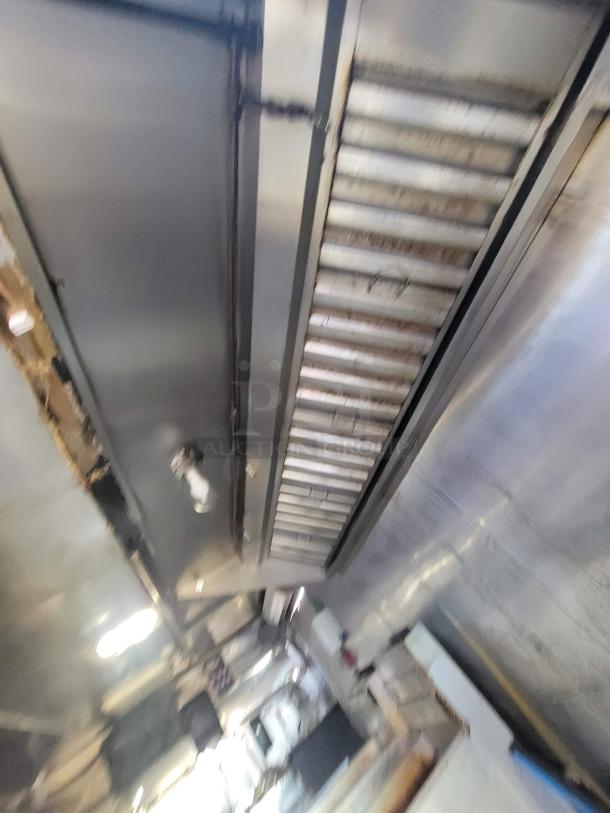 2019 Anvil 16' food trailer interior with severe grease damage, requiring full restoration. Visible exhaust hood, smoke damage present.