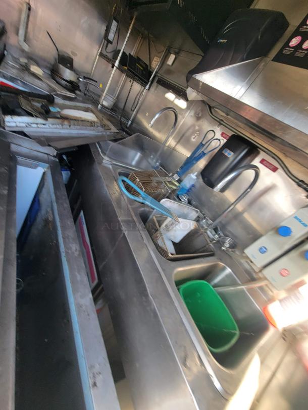 2019 Anvil 16' food trailer interior, heavily damaged with grease and carbon buildup. Requires full restoration.