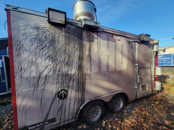 2019 Anvil 16' tandem axle food trailer with exterior grease damage, used by "NBRHD KITCHENS," for restoration or scrap.