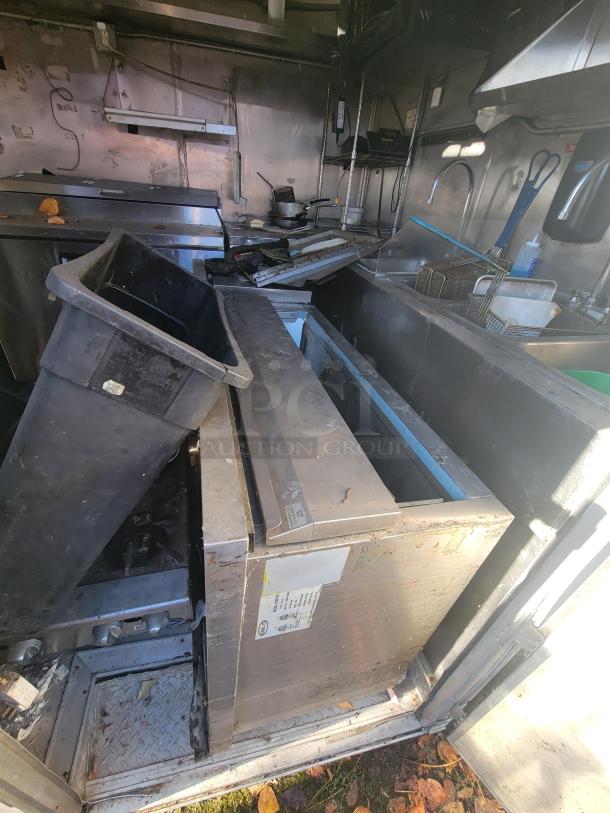 2019 Anvil 16' Tandem Axle Food Trailer interior with extensive grease and smoke damage, requiring full restoration.