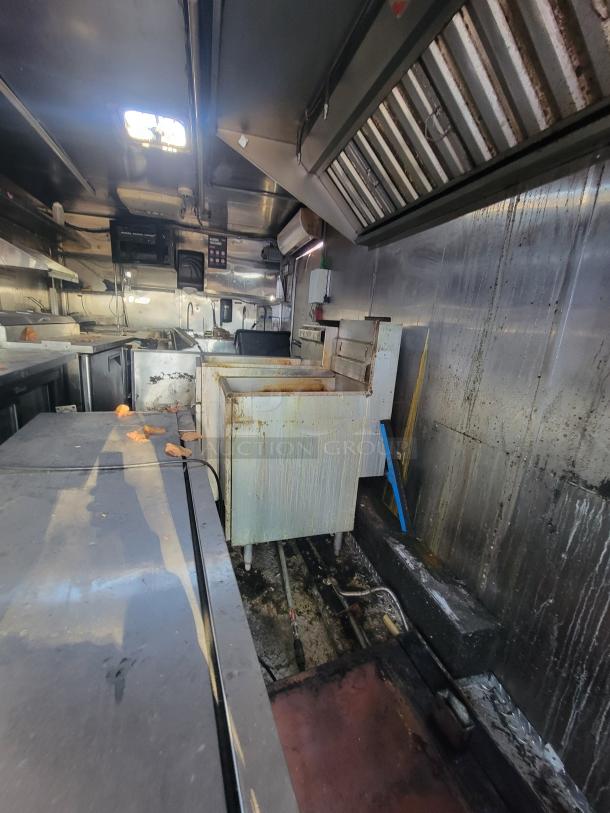 2019 Anvil 16' food trailer interior; severe grease damage, extensive restoration needed, used by "NBRHD KITCHENS".