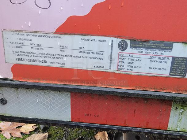 Label on the Southern Dimensions Group 2021 trailer shows tire specs ST235/80-R16, max cargo 4,500 lbs, VIN 4S9S1EF27MW364520.