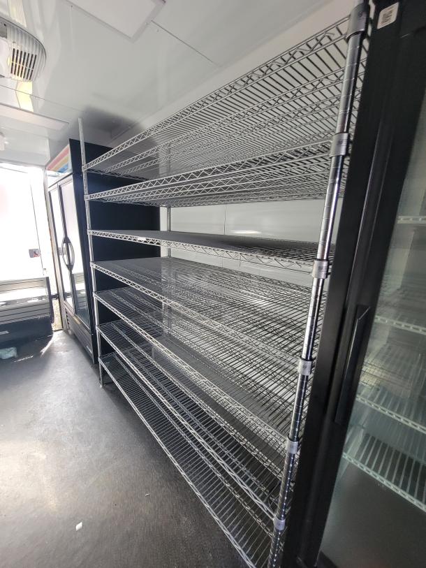 2021 SDG 20' Mobile Market Trailer interior with shelving, True coolers, and prep area. Ideal for high-volume mobile business.