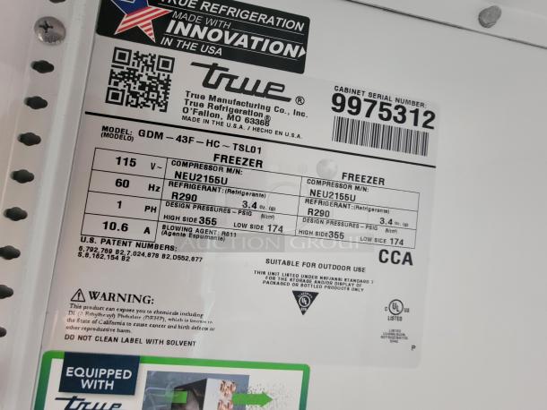 Label inside a True Manufacturing freezer shows model GDM-43F-HC-TSL01. Features include 115V, 60Hz, and R290 refrigerant.