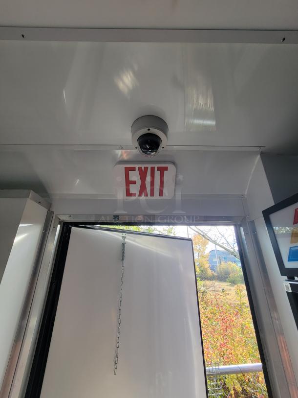 Interior of a 2021 SDG 20' Mobile Market Trailer featuring an exit sign and security camera.