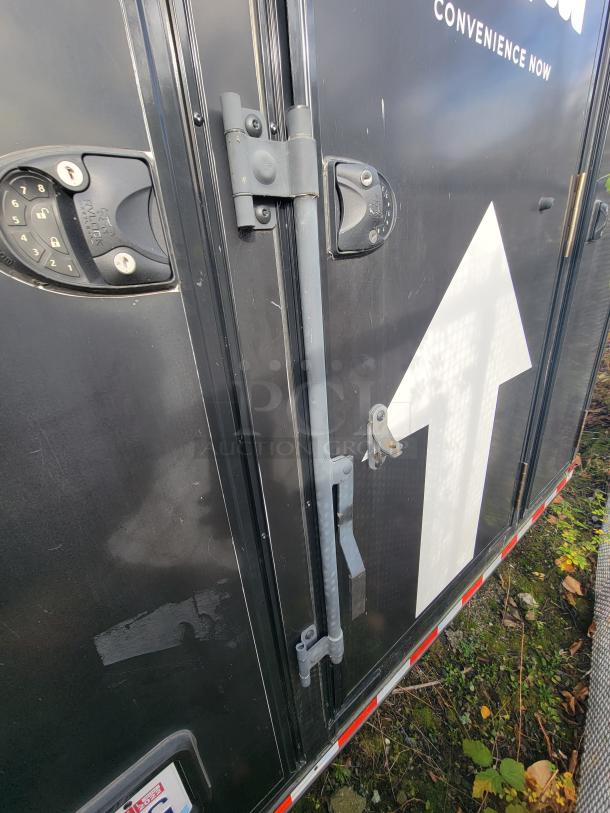 SDG 2021 20' Mobile Market Trailer. Black exterior with secure lock and hinge. Features True coolers, prep sink, POS station.