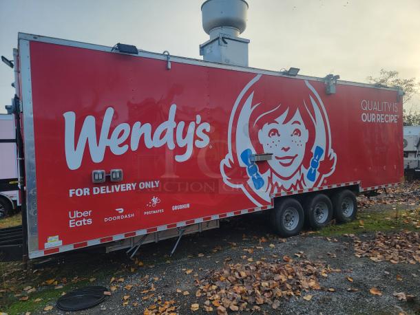 Brand-new 2022 Rock Solid Cargo 28' triple-axle ghost kitchen trailer featuring Wendy's branding, equipped for delivery service.