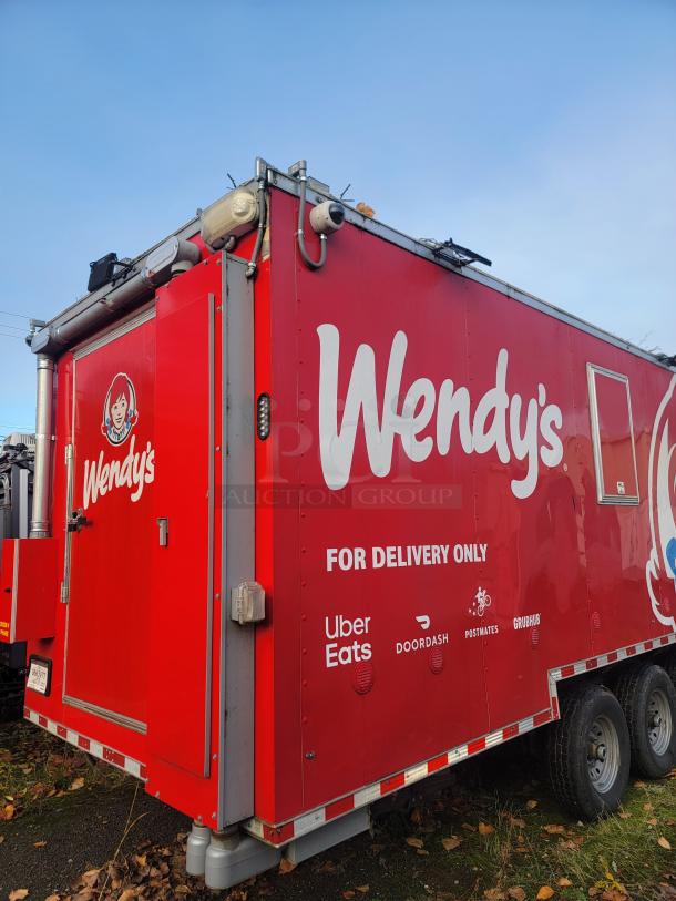 Brand new 2022 Rock Solid Cargo 28' ghost kitchen trailer. Bright red with Wendy's branding and delivery logos. Includes top equipment.