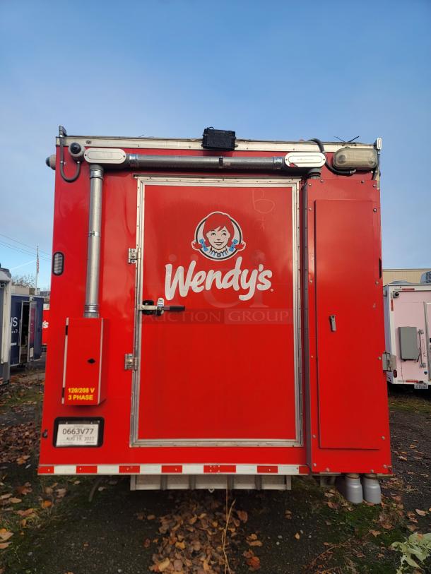 Brand new 2022 Rock Solid Cargo 28' ghost kitchen trailer in red with Wendy's logo. Unused, includes top-tier cooking equipment.