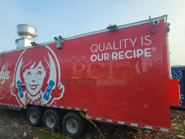 2022 Rock Solid Cargo 28' triple-axle ghost kitchen trailer, red exterior, Wendy's branding, never used, high-efficiency equipment.