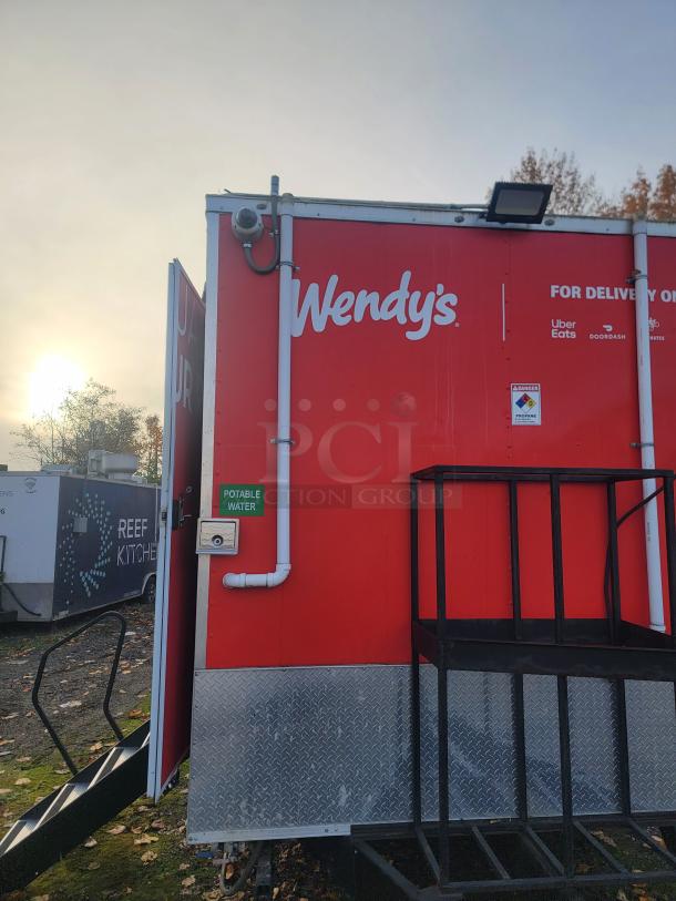 Rare 2022 Rock Solid Cargo 28' ghost kitchen trailer, red with Wendy's logo. New, unused, equipped for high-volume delivery.
