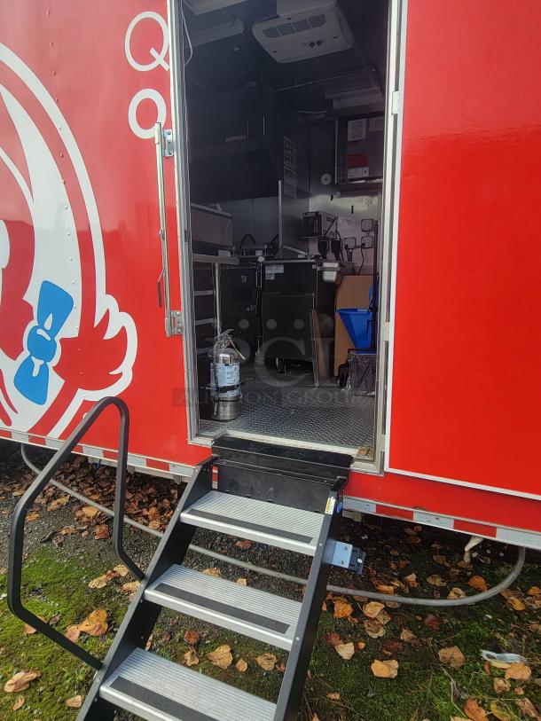 Never-used 2022 Rock Solid Cargo 28' ghost kitchen trailer, red exterior, equipped with top-line commercial kitchen.