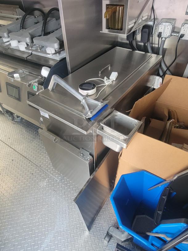 Interior view of a new 2022 Rock Solid Cargo 28' ghost kitchen trailer. Features Henny Penny fryer, Antunes toaster, Turbo Air refrigeration.