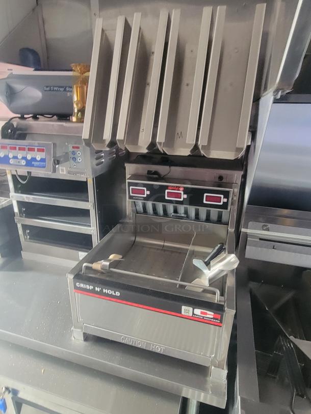 2022 Rock Solid Cargo ghost kitchen trailer interior with new kitchen equipment, including a Crisp N' Hold unit by Carter-Hoffmann.