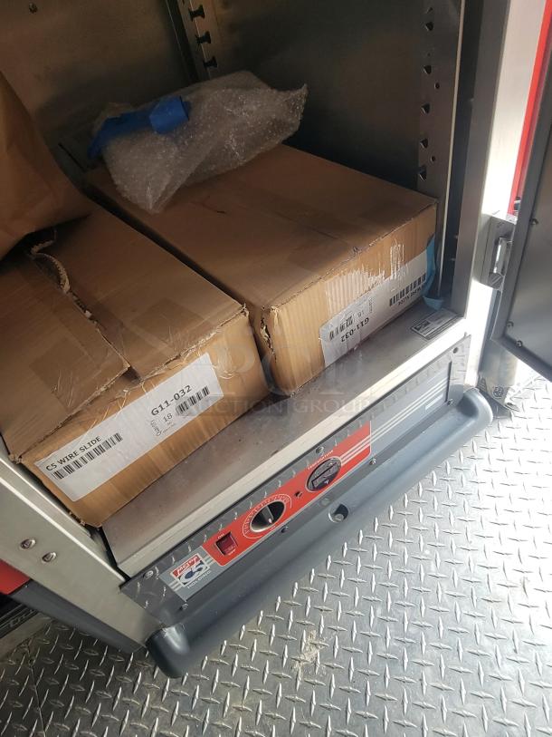 Interior view of a new 2022 Rock Solid Cargo 28' trailer. Features include boxed equipment and a Fast ECU module.