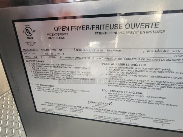 Label on Henny Penny fryer in a 2022 Rock Solid Cargo ghost kitchen trailer, showing model EEG-253, electrical specs, and usage instructions.