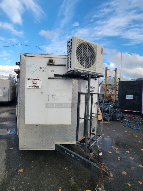 Quality Cargo Model 24 trailer, marked "Reef Kitchens" with AC unit, signs "No Smoking." Used condition, steel frame.