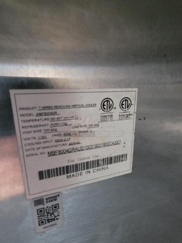 Quality Cargo Model 24 with visible label showing specifications: temperature range, refrigerant type, and voltage. Made in China.