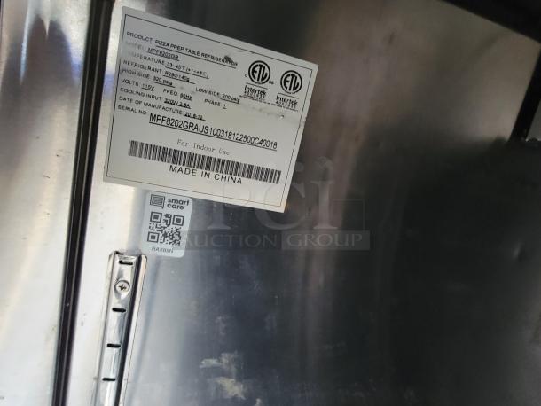 Quality Cargo Model 24 refrigerator label, serial MPF8202GRAUS, dated 2018-12, ETL certified, for indoor use.