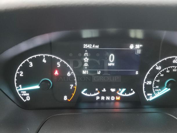 Dashboard of 2020 Ford Transit-350 showing odometer at 2,542.4 miles, temperature at 38°F, and PRNDM gear indicator.