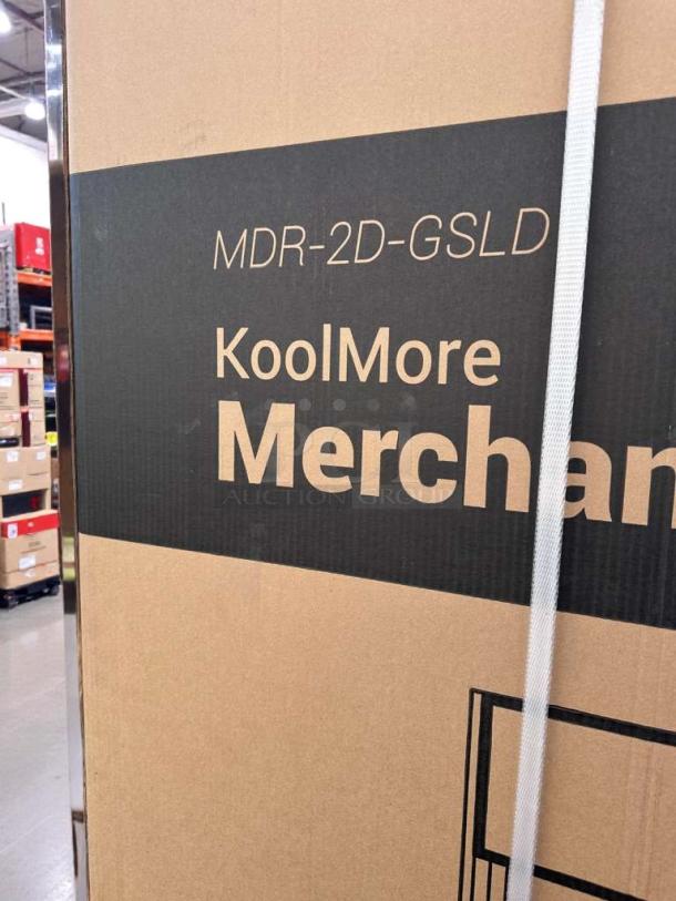 Brand new KoolMore 53" two-door glass merchandiser refrigerator in packaging, model MDR-2D-GSLD, ideal for commercial display.