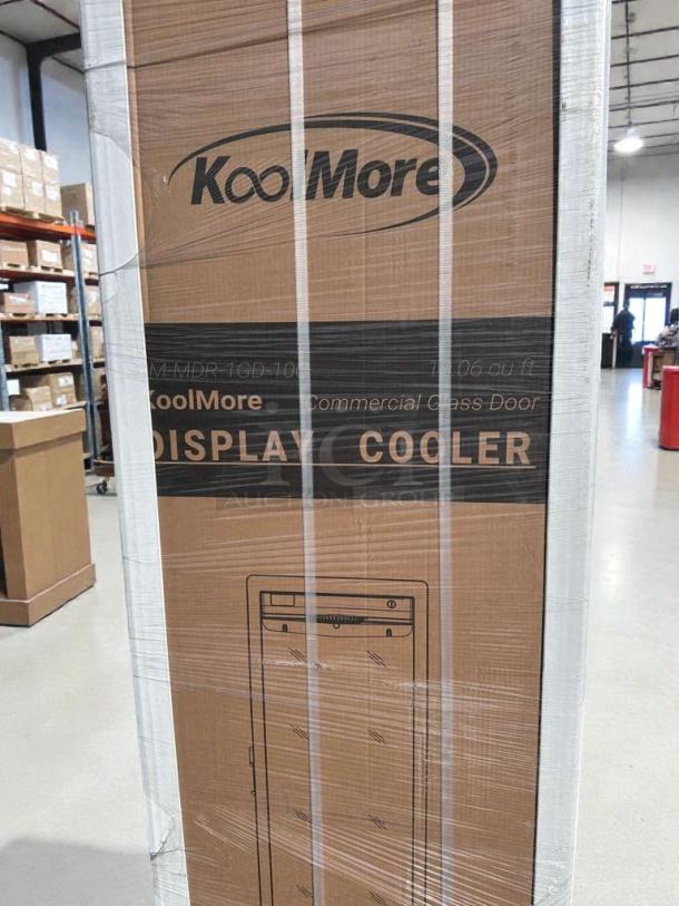 Brand new KoolMore commercial glass door refrigerator, model MDR1GD12C, in packaging. Scratch & dent condition.