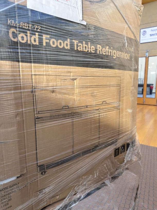 Brand new KoolMore 72" commercial refrigerated prep station in packaging, model KM-RBT-72CSFG, with sneeze guard.