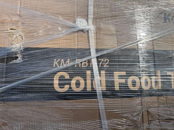 KoolMore 72" refrigerated prep station, model KM-RBT-72CSFG, in packaging. Marked "KM RBT 72 Cold Food Table." Brand new.