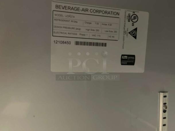 Beverage-Air UCR27A undercounter refrigerator label showing model, refrigerant type, and electrical ratings.