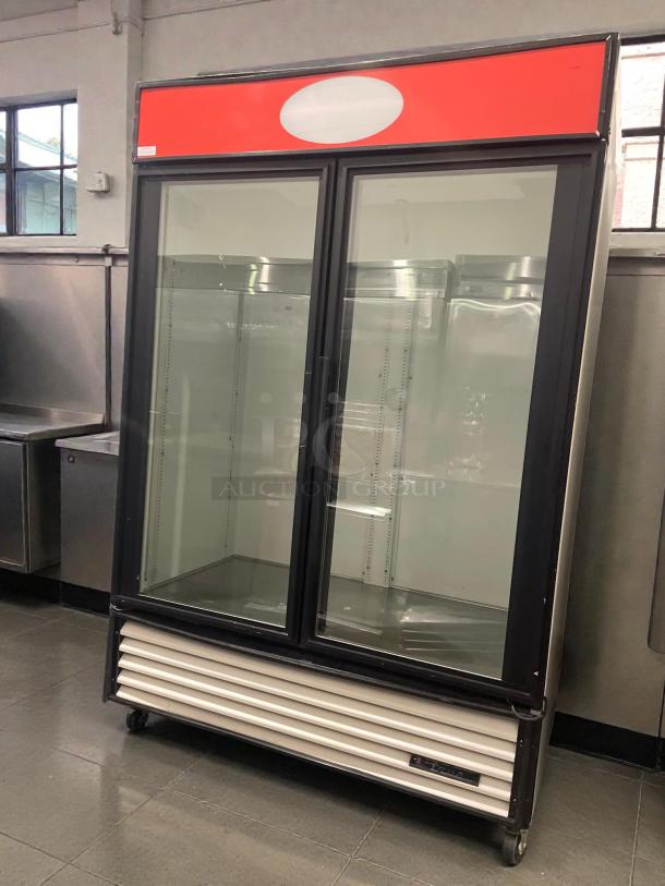 True GDM-49 Glass Door Merchandiser, premium condition, dual glass doors, 115V, tested and working, by True Manufacturing.